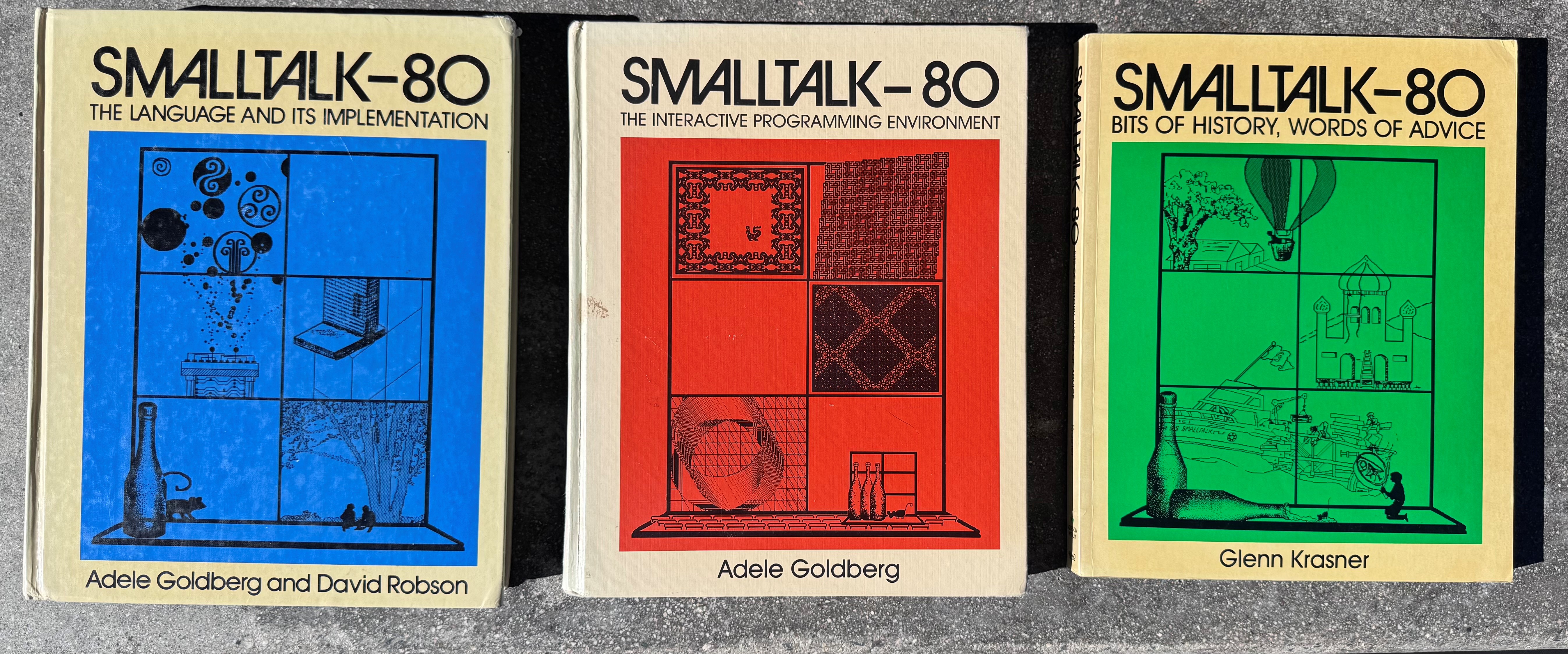 The three Smalltalk-80 books: the Blue Book (The Language and Its Implementation, Goldberg & Robson), the Orange Book (The Interactive Programming Environment, Goldberg), and the Green Book (Bits of History, Words of Advice, Krasner)